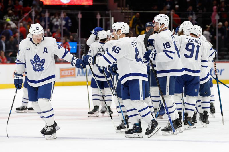 Nov 13, 2024; Washington, District of Columbia, USA; Toronto Maple Leafs players celebrate after their game against the Washington Capitals at Capital One Arena. Mandatory Credit: Geoff Burke-Imagn Images