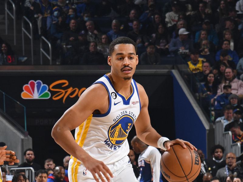 SAN FRANCISCO, CA - MARCH 24: Jordan Poole #3 of the Golden State Warriors dribbles the ball during the game against the Philadelphia 76ers on March 24, 2023 at Chase Center in San Francisco, California. NOTE TO USER: User expressly acknowledges and agrees that, by downloading and or using this photograph, user is consenting to the terms and conditions of Getty Images License Agreement. Mandatory Copyright Notice: Copyright 2023 NBAE (Photo by Noah Graham/NBAE via Getty Images)