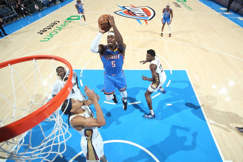 OKLAHOMA CITY, OK - NOVEMBER 13: Luguentz Dort #5 of the Oklahoma City Thunder drives to the basket during the game against the New Orleans Pelicans on November 13, 2024 at Paycom Center in Oklahoma City, Oklahoma. NOTE TO USER: User expressly acknowledges and agrees that, by downloading and or using this photograph, User is consenting to the terms and conditions of the Getty Images License Agreement. Mandatory Copyright Notice: Copyright 2024 NBAE (Photo by Nathaniel S. Butler/NBAE via Getty Images)