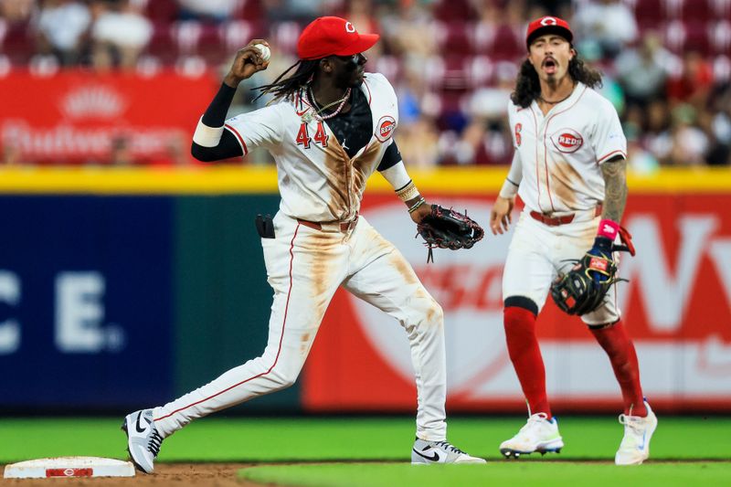 May 21, 2024; Cincinnati, Ohio, USA; Cincinnati Reds shortstop Elly De La Cruz (44) throws to first to get San Diego Padres first baseman Jake Cronenworth (not pictured) out to complete the double play in the ninth inning at Great American Ball Park. Mandatory Credit: Katie Stratman-USA TODAY Sports