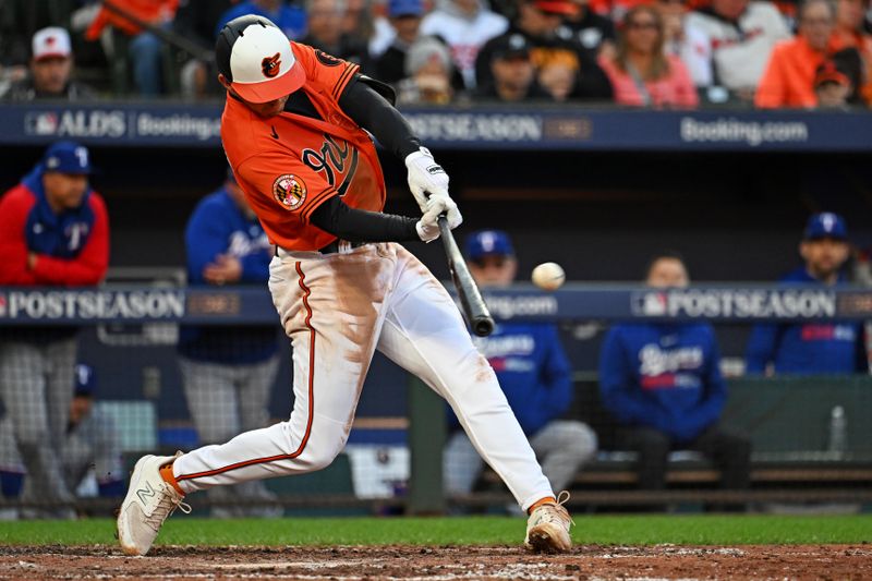 Oct 8, 2023; Baltimore, Maryland, USA; Baltimore Orioles second baseman Jordan Westburg (11) hits a double during the fourth inning against the Texas Rangers during game two of the ALDS for the 2023 MLB playoffs at Oriole Park at Camden Yards. Mandatory Credit: Tommy Gilligan-USA TODAY Sports