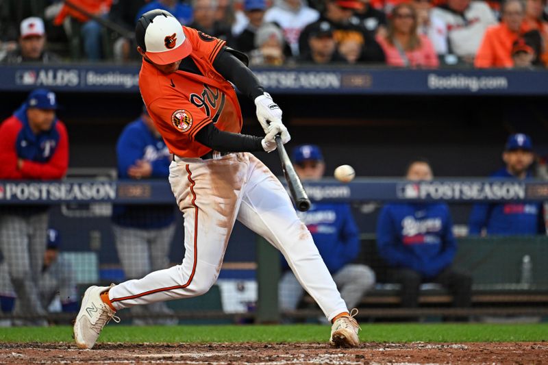 Oct 8, 2023; Baltimore, Maryland, USA; Baltimore Orioles second baseman Jordan Westburg (11) hits a double during the fourth inning against the Texas Rangers during game two of the ALDS for the 2023 MLB playoffs at Oriole Park at Camden Yards. Mandatory Credit: Tommy Gilligan-USA TODAY Sports