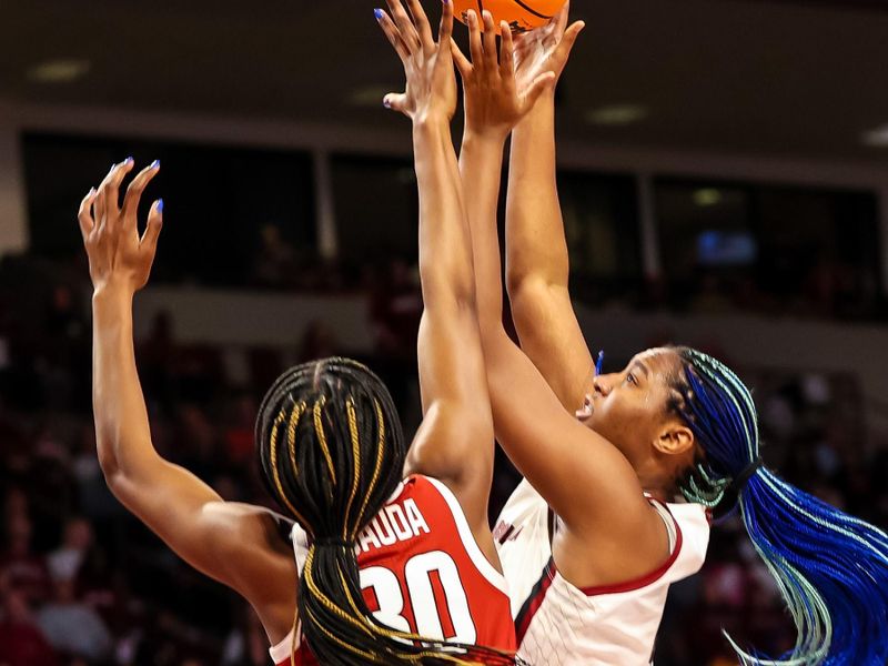 Jan 22, 2023; Columbia, South Carolina, USA; South Carolina Gamecocks forward Aliyah Boston (4) shoots over Arkansas Razorbacks forward Maryam Dauda (30) in the first half at Colonial Life Arena. Mandatory Credit: Jeff Blake-USA TODAY Sports