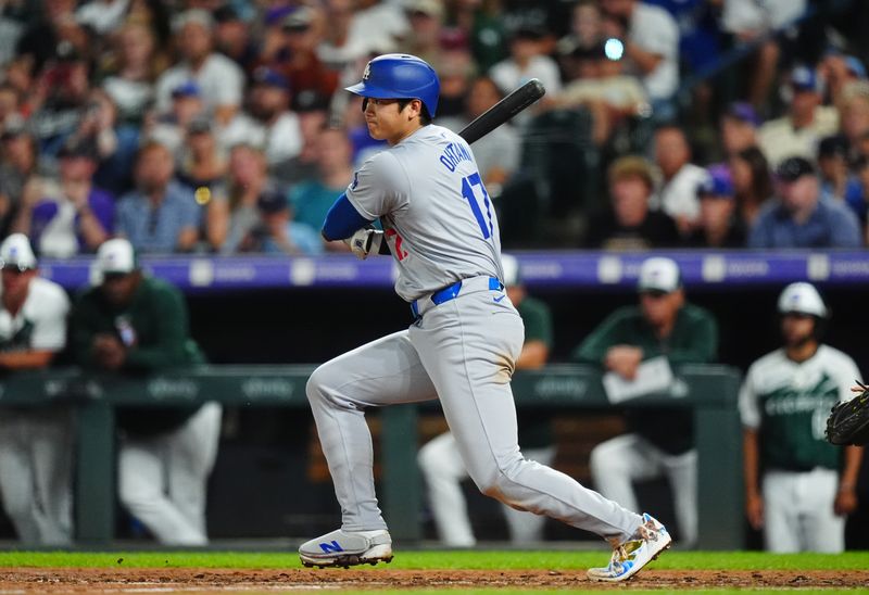 Sep 28, 2024; Denver, Colorado, USA; Los Angeles Dodgers designated hitter Shohei Ohtani (17) singles in the sixth inning against the Colorado Rockies at Coors Field. Mandatory Credit: Ron Chenoy-Imagn Images 