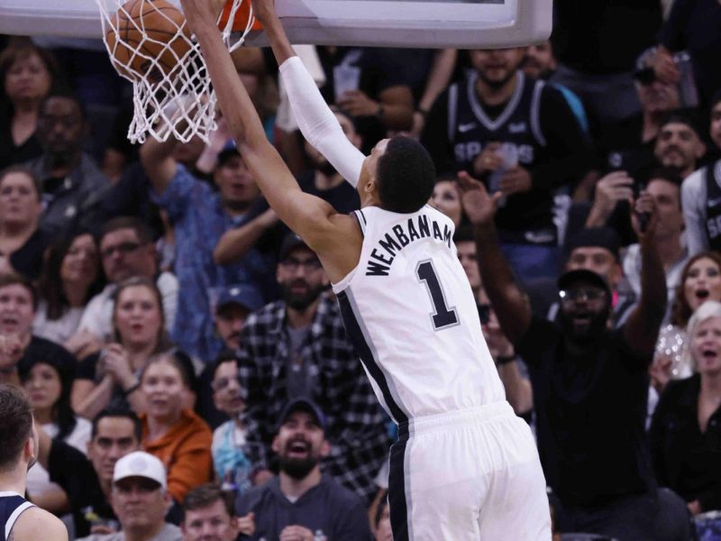 SAN ANTONIO, TEXAS - OCTOBER 25: Victor Wembanyama #1 of the San Antonio Spurs dunks during the fourth quarter against the Dallas Mavericks at Frost Bank Center on October 25, 2023 in San Antonio, Texas. NOTE TO USER: User expressly acknowledges and agrees that, by downloading and/or using this Photograph, user is consenting to the terms and conditions of the Getty Images License Agreement. (Photo by Ronald Cortes/Getty Images)