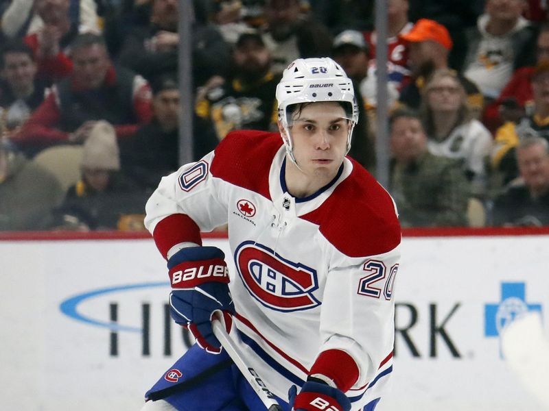 Jan 27, 2024; Pittsburgh, Pennsylvania, USA;  Montreal Canadiens left wing Juraj Slafkovsky (20) skates up ice with the puck against the Pittsburgh Penguins during the second period at PPG Paints Arena. Mandatory Credit: Charles LeClaire-USA TODAY Sports