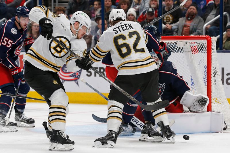 Jan 2, 2024; Columbus, Ohio, USA; Boston Bruins center Jakub Lauko (94) reaches for the rebound of a Columbus Blue Jackets goalie Spencer Martin (30) save during the second period at Nationwide Arena. Mandatory Credit: Russell LaBounty-USA TODAY Sports