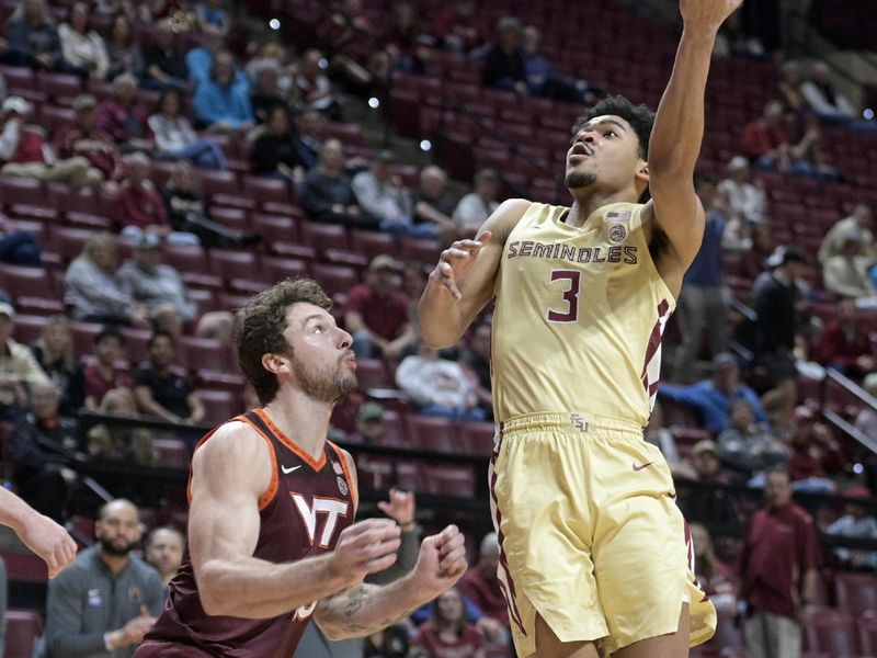 Jan 29, 2025; Tallahassee, Florida, USA; Florida State Seminoles guard Bostyn Holt (3) shoots the ball past Virginia Tech Hokies forward Ben Burnham (13) during the first half at Donald L. Tucker Center. Mandatory Credit: Melina Myers-Imagn Images