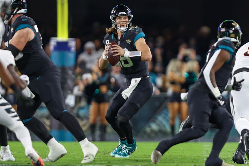 Jacksonville Jaguars quarterback Trevor Lawrence (16) wears customized My Cause My Cleats shoes in action during an NFL football game against the Cincinnati Bengals, Monday, Dec. 4, 2023, in Jacksonville, Fla. (AP Photo/Gary McCullough)