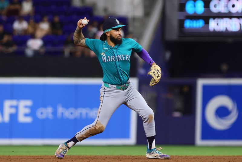 Jun 21, 2024; Miami, Florida, USA; Seattle Mariners shortstop J.P. Crawford (3) throws to first base to retire Miami Marlins catcher Nick Fortes (not pictured) during the third inning at loanDepot Park. Mandatory Credit: Sam Navarro-USA TODAY Sports