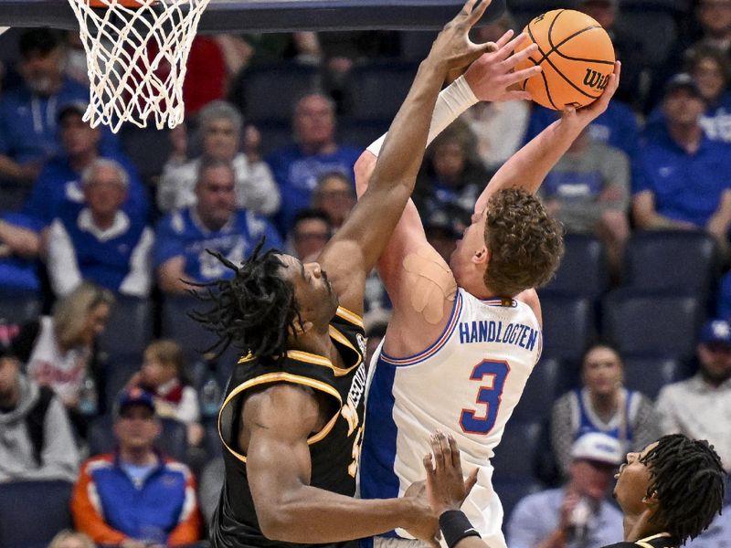 Mar 14, 2025; Nashville, TN, USA;  Florida Gators center Micah Handlogten (3) shoots over  Missouri Tigers center Josh Gray (33) during the second half at Bridgestone Arena. Mandatory Credit: Steve Roberts-Imagn Images