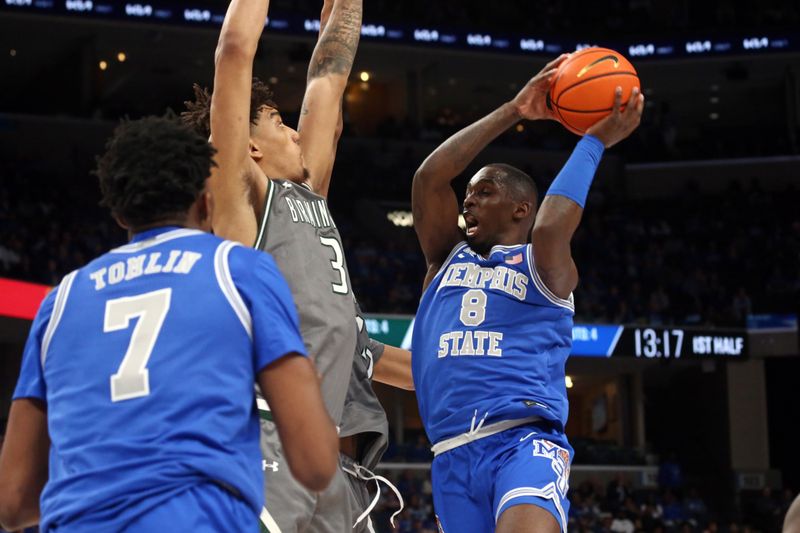 Mar 3, 2024; Memphis, Tennessee, USA; Memphis Tigers forward David Jones (8) drives to the basket as UAB Blazers forward Yaxel Lendeborg (3) defends during the first half at FedExForum. Mandatory Credit: Petre Thomas-USA TODAY Sports