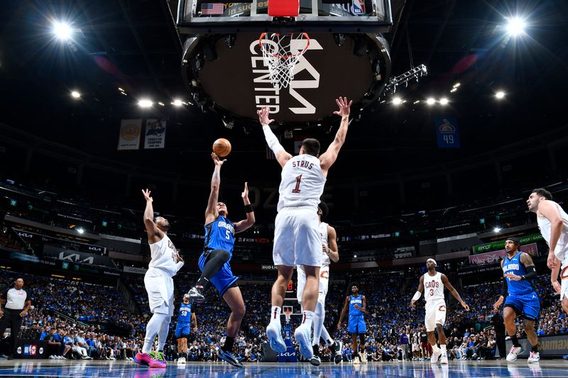 ORLANDO, FL - APRIL 27: Paolo Banchero #5 of the Orlando Magic shoots the ball during the game against the Cleveland Cavaliers during Round 1 Game 4 of the 2024 NBA Playoffs on April 27, 2024 at the Kia Center in Orlando, Florida. NOTE TO USER: User expressly acknowledges and agrees that, by downloading and or using this photograph, User is consenting to the terms and conditions of the Getty Images License Agreement. Mandatory Copyright Notice: Copyright 2024 NBAE (Photo by Fernando Medina/NBAE via Getty Images)