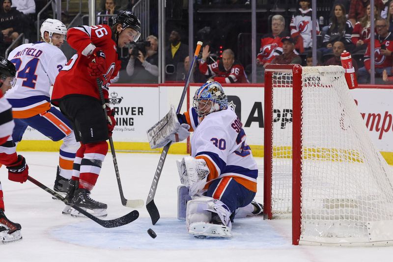 Oct 25, 2024; Newark, New Jersey, USA; New York Islanders goaltender Ilya Sorokin (30) makes a save against the New Jersey Devils during the second period at Prudential Center. Mandatory Credit: Ed Mulholland-Imagn Images