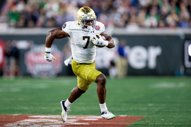 Dec 30, 2022; Jacksonville, FL, USA; Notre Dame Fighting Irish running back Audric Estime (7) runs with the ball during the second half against the South Carolina Gamecocks in the 2022 Gator Bowl at TIAA Bank Field. Mandatory Credit: Matt Pendleton-USA TODAY Sports