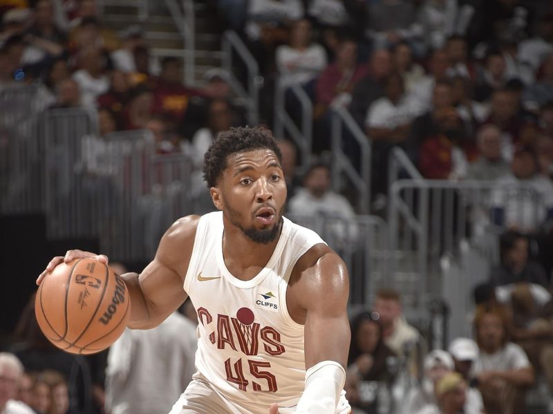 CLEVELAND, OH - APRIL 22: Donovan Mitchell #45 of the Cleveland Cavaliers handles the ball during the game against the Orlando Magic during Round 1 Game 2 of the 2024 NBA Playoffs on April 22, 2024 at Rocket Mortgage FieldHouse in Cleveland, Ohio. NOTE TO USER: User expressly acknowledges and agrees that, by downloading and/or using this Photograph, user is consenting to the terms and conditions of the Getty Images License Agreement. Mandatory Copyright Notice: Copyright 2024 NBAE (Photo by David Liam Kyle/NBAE via Getty Images)