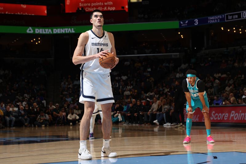 MEMPHIS, TN - OCTOBER 10: Zach Edey #14 of the Memphis Grizzlies shoots a free throw during the game against the Charlotte Hornets during a NBA Preseason game on October 10, 2024 at FedExForum in Memphis, Tennessee. NOTE TO USER: User expressly acknowledges and agrees that, by downloading and or using this photograph, User is consenting to the terms and conditions of the Getty Images License Agreement. Mandatory Copyright Notice: Copyright 2024 NBAE (Photo by Joe Murphy/NBAE via Getty Images)