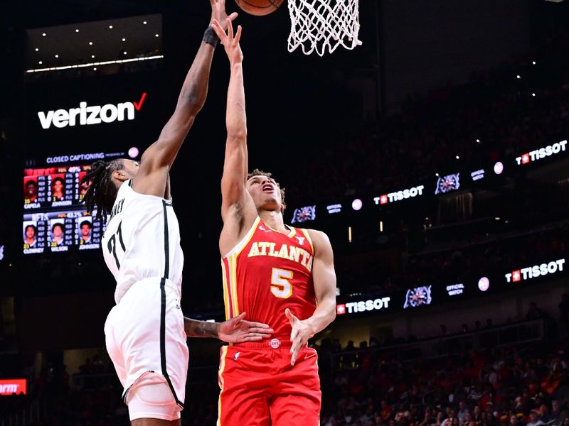 ATLANTA, GA - OCTOBER 23: Dyson Daniels #5 of the Atlanta Hawks shoots the ball during the game against the Brooklyn Nets on October 23, 2024 at State Farm Arena in Atlanta, Georgia.  NOTE TO USER: User expressly acknowledges and agrees that, by downloading and/or using this Photograph, user is consenting to the terms and conditions of the Getty Images License Agreement. Mandatory Copyright Notice: Copyright 2024 NBAE (Photo by Adam Hagy/NBAE via Getty Images)