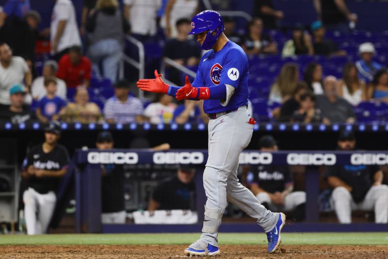 Aug 23, 2024; Miami, Florida, USA; Chicago Cubs catcher Miguel Amaya (9) scores after hitting a two-run home run against the Miami Marlins during the ninth inning at loanDepot Park. Mandatory Credit: Sam Navarro-USA TODAY Sports