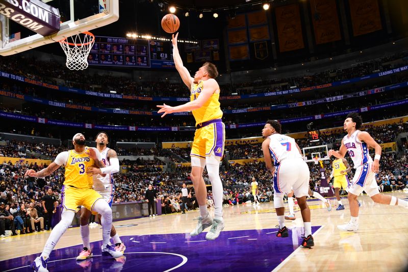 LOS ANGELES, CA - NOVEMBER 8: Dalton Knecht #4 of the Los Angeles Lakers shoots the ball during the game against the Philadelphia 76ers on Novemberr 8, 2024 at Crypto.Com Arena in Los Angeles, California. NOTE TO USER: User expressly acknowledges and agrees that, by downloading and/or using this Photograph, user is consenting to the terms and conditions of the Getty Images License Agreement. Mandatory Copyright Notice: Copyright 2024 NBAE (Photo by Adam Pantozzi/NBAE via Getty Images)