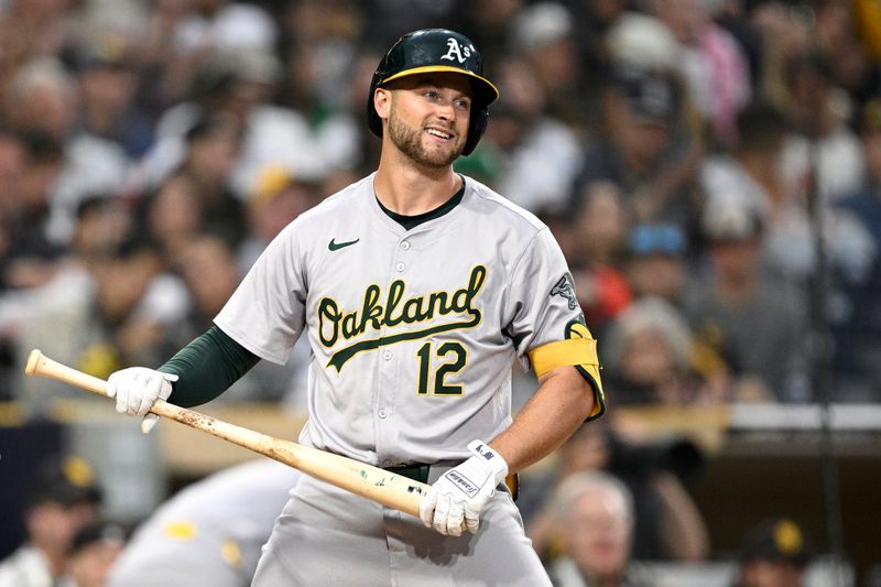 Jun 10, 2024; San Diego, California, USA; Oakland Athletics shortstop Max Schuemann (12) reacts after striking out to end the top of the fourth inning against the San Diego Padres at Petco Park. Mandatory Credit: Orlando Ramirez-USA TODAY Sports