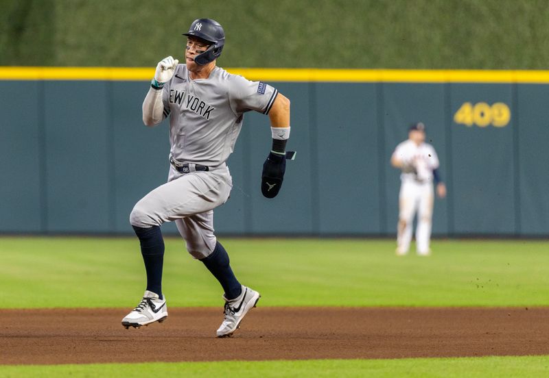 Sep 2, 2023; Houston, Texas, USA; New York Yankees right fielder Aaron Judge (99) runs from first to third base against the Houston Astros in the fifth inning at Minute Maid Park. Mandatory Credit: Thomas Shea-USA TODAY Sports