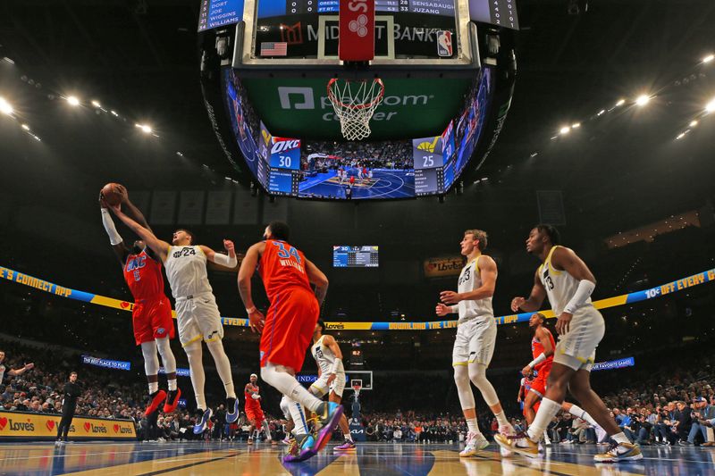 OKLAHOMA CITY, OK - DECEMBER 3: Walker Kessler #24 of the Utah Jazz and Luguentz Dort #5 of the Oklahoma City Thunder grabs the rebound during the game during the Emirates NBA Cup game on on December 3, 2024 at Paycom Center in Oklahoma City, Oklahoma. NOTE TO USER: User expressly acknowledges and agrees that, by downloading and or using this photograph, User is consenting to the terms and conditions of the Getty Images License Agreement. Mandatory Copyright Notice: Copyright 2024 NBAE (Photo by Zach Beeker/NBAE via Getty Images)