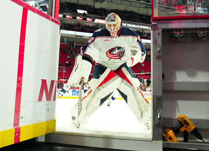 Nov 26, 2023; Raleigh, North Carolina, USA; Columbus Blue Jackets goaltender Elvis Merzlikins (90) comes off the ice after the warmups against the Carolina Hurricanes at PNC Arena. Mandatory Credit: James Guillory-USA TODAY Sports