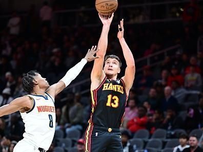 ATLANTA, GA - DECEMBER 11: Bogdan Bogdanovic #13 of the Atlanta Hawks shoots the ball during the game against the Denver Nuggets on December 11, 2023 at State Farm Arena in Atlanta, Georgia.  NOTE TO USER: User expressly acknowledges and agrees that, by downloading and/or using this Photograph, user is consenting to the terms and conditions of the Getty Images License Agreement. Mandatory Copyright Notice: Copyright 2023 NBAE (Photo by Adam Hagy/NBAE via Getty Images)