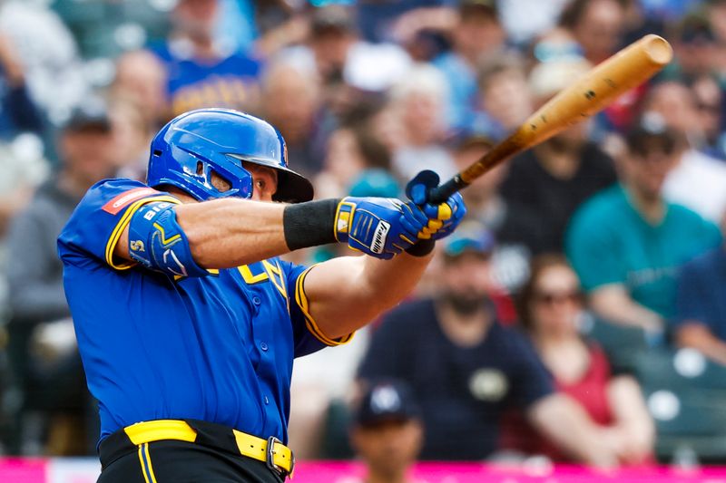 May 30, 2025; Seattle, Washington, USA; Seattle Mariners catcher Cal Raleigh (29) hits a three-run home run against the Minnesota Twins during the first inning at T-Mobile Park. Mandatory Credit: Joe Nicholson-Imagn Images