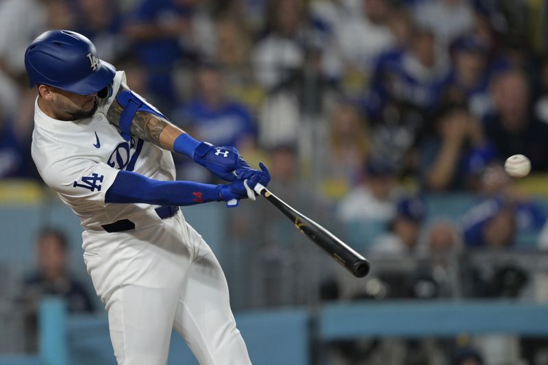 Jun 13, 2024; Los Angeles, California, USA; Los Angeles Dodgers center fielder Andy Pages (44) hits a solo home run in the seventh inning against the Texas Rangers at Dodger Stadium. Mandatory Credit: Jayne Kamin-Oncea-USA TODAY Sports