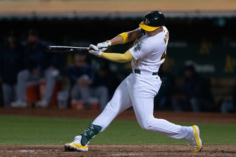 Sep 18, 2023; Oakland, California, USA;  Oakland Athletics first baseman Ryan Noda (49) hits a single during the eighth inning against the Seattle Mariners at Oakland-Alameda County Coliseum. Mandatory Credit: Stan Szeto-USA TODAY Sports