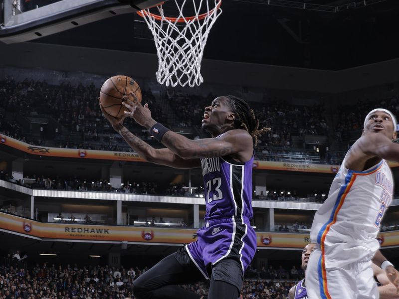 SACRAMENTO, CA - NOVEMBER 25: Keon Ellis #23 of the Sacramento Kings drives to the basket during the game against the Oklahoma City Thunder on November 25, 2024 at Golden 1 Center in Sacramento, California. NOTE TO USER: User expressly acknowledges and agrees that, by downloading and or using this Photograph, user is consenting to the terms and conditions of the Getty Images License Agreement. Mandatory Copyright Notice: Copyright 2024 NBAE (Photo by Rocky Widner/NBAE via Getty Images)