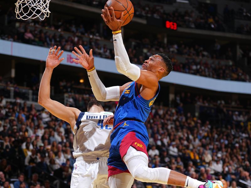 DENVER, CO - NOVEMBER 22: Russell Westbrook #4 of the Denver Nuggets drives to the basket during the game against the Dallas Mavericks during the Emirates NBA Cup game on November 22, 2024 at Ball Arena in Denver, Colorado. NOTE TO USER: User expressly acknowledges and agrees that, by downloading and/or using this Photograph, user is consenting to the terms and conditions of the Getty Images License Agreement. Mandatory Copyright Notice: Copyright 2024 NBAE (Photo by Garrett Ellwood/NBAE via Getty Images)