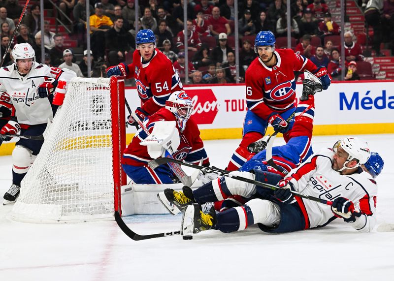 Oct 21, 2023; Montreal, Quebec, CAN; Montreal Canadiens goalie Jake Allen (34) makes a save against Washington Capitals left wing Alex Ovechkin (8) laying on the ice during the first period at Bell Centre. Mandatory Credit: David Kirouac-USA TODAY Sports