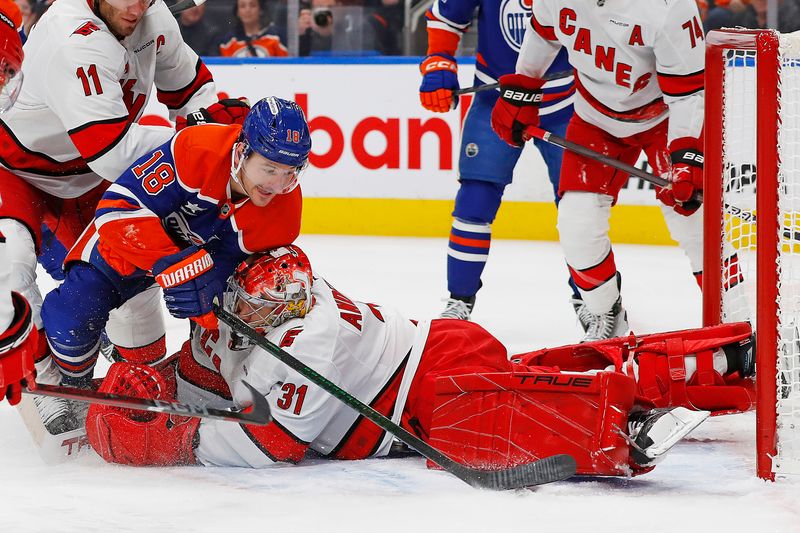 Oct 22, 2024; Edmonton, Alberta, CAN; Carolina Hurricanes goaltender Frederik Andersen (31) makes a save on  on Edmonton Oilers forward Zach Hyman (18) during the first period at Rogers Place. Mandatory Credit: Perry Nelson-Imagn Images