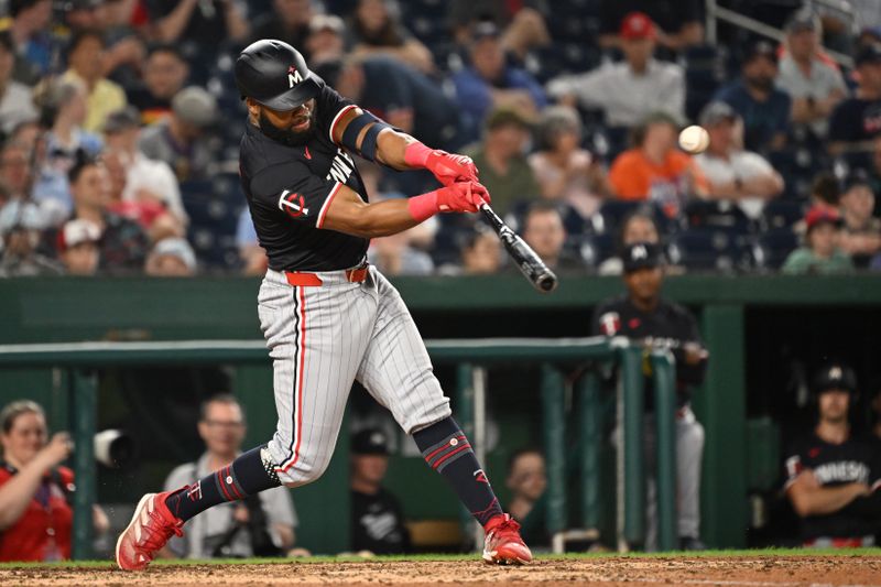 May 20, 2024; Washington, District of Columbia, USA; Minnesota Twins outfielder Manuel Margot (13) gets a base hit against the Washington Nationals during the eighth inning at Nationals Park. Mandatory Credit: Rafael Suanes-USA TODAY Sports