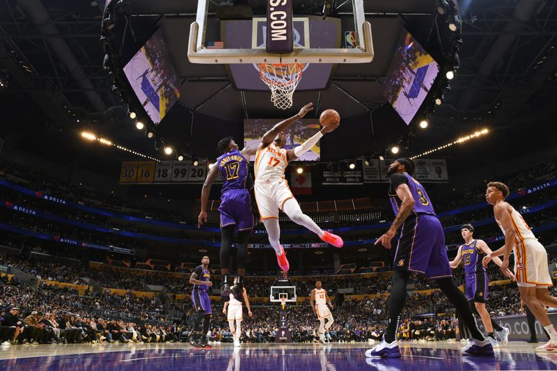 LOS ANGELES, CA - JANUARY 3: Onyeka Okongwu #17 of the Atlanta Hawks drives to the basket during the game against the Los Angeles Lakers on January 3, 2025 at Crypto.Com Arena in Los Angeles, California. NOTE TO USER: User expressly acknowledges and agrees that, by downloading and/or using this Photograph, user is consenting to the terms and conditions of the Getty Images License Agreement. Mandatory Copyright Notice: Copyright 2025 NBAE (Photo by Adam Pantozzi/NBAE via Getty Images)