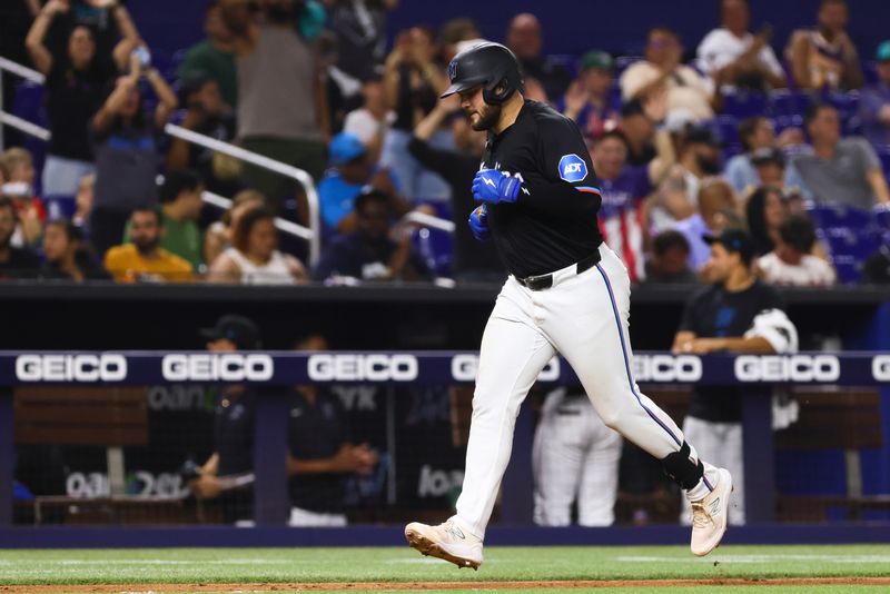 Jul 19, 2024; Miami, Florida, USA; Miami Marlins first baseman Jake Burger (36) circles the bases after hitting a solo home run against the New York Mets during the fifth inning at loanDepot Park. Mandatory Credit: Sam Navarro-USA TODAY Sports