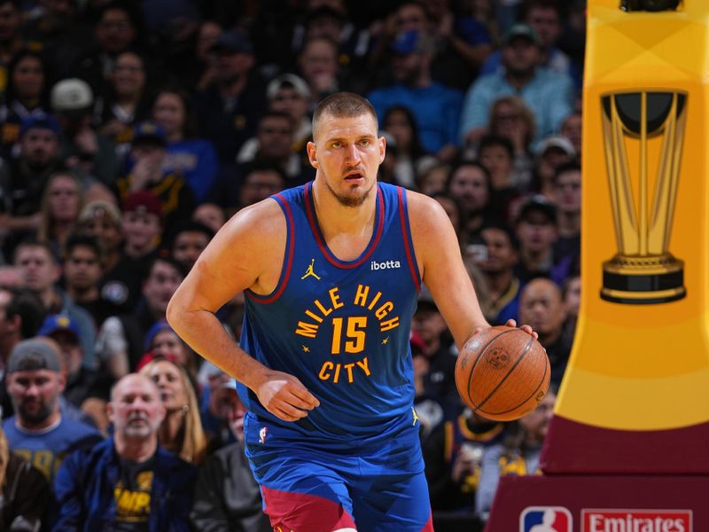 DENVER, CO - DECEMBER 3: Nikola Jokic #15 of the Denver Nuggets dribbles the ball during the game against the Golden State Warriors during the Emirates NBA Cup on December 3, 2024 at Ball Arena in Denver, Colorado. NOTE TO USER: User expressly acknowledges and agrees that, by downloading and/or using this Photograph, user is consenting to the terms and conditions of the Getty Images License Agreement. Mandatory Copyright Notice: Copyright 2024 NBAE (Photo by Garrett Ellwood/NBAE via Getty Images)