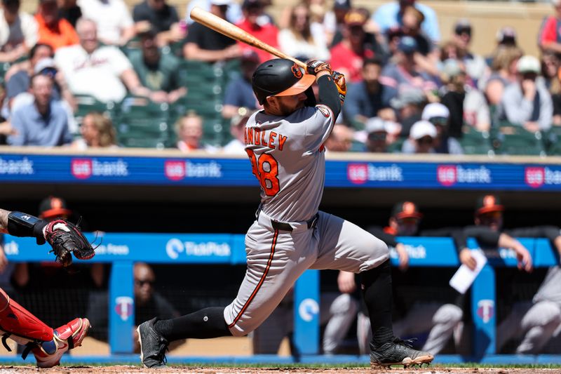 May 8, 2025; Minneapolis, Minnesota, USA; Baltimore Orioles catcher Maverick Handley (98) hits his first career base hit against the Minnesota Twins during the fourth inning at Target Field. Mandatory Credit: Matt Krohn-Imagn Images