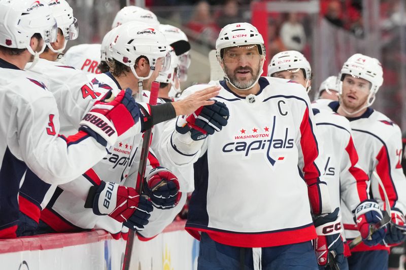 Nov 11, 2025; Raleigh, North Carolina, USA;  Washington Capitals left wing Alex Ovechkin (8) celebrates his empty net goal against the Carolina Hurricanes during the third period at Lenovo Center. Mandatory Credit: James Guillory-Imagn Images