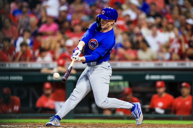 Jul 31, 2024; Cincinnati, Ohio, USA; Chicago Cubs outfielder Pete Crow-Armstrong (52) hits a single in the sixth inning against the Cincinnati Reds at Great American Ball Park. Mandatory Credit: Katie Stratman-USA TODAY Sports