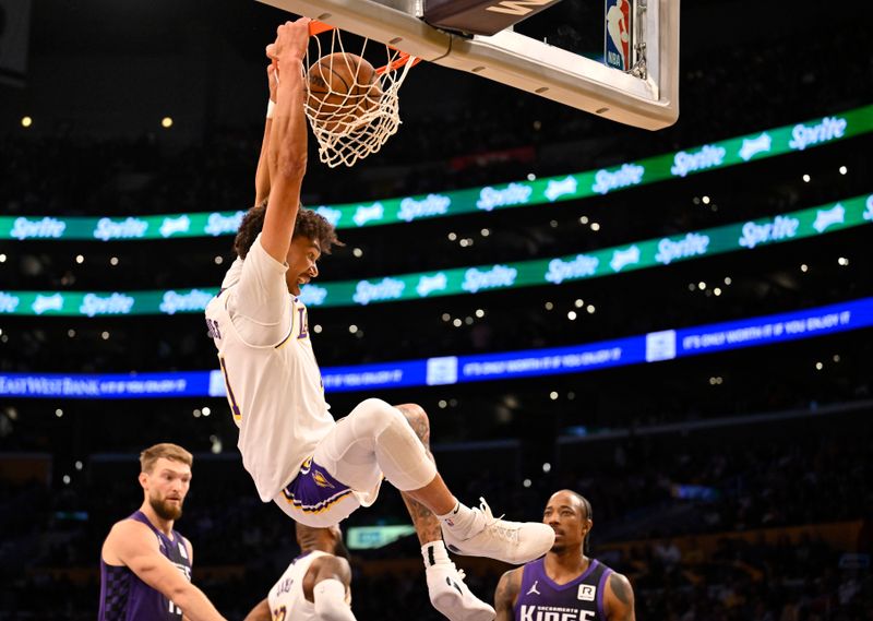 LOS ANGELES, CALIFORNIA - OCTOBER 26: Jaxson Hayes #11 of the Los Angeles Lakers dunks the ball while Sacramento Kings defenders look on at Crypto.com Arena on October 26, 2024 in Los Angeles, California. NOTE TO USER: User expressly acknowledges and agrees that, by downloading and or using this photograph, User is consenting to the terms and conditions of the Getty Images License Agreement. (Photo by John McCoy/Getty Images)