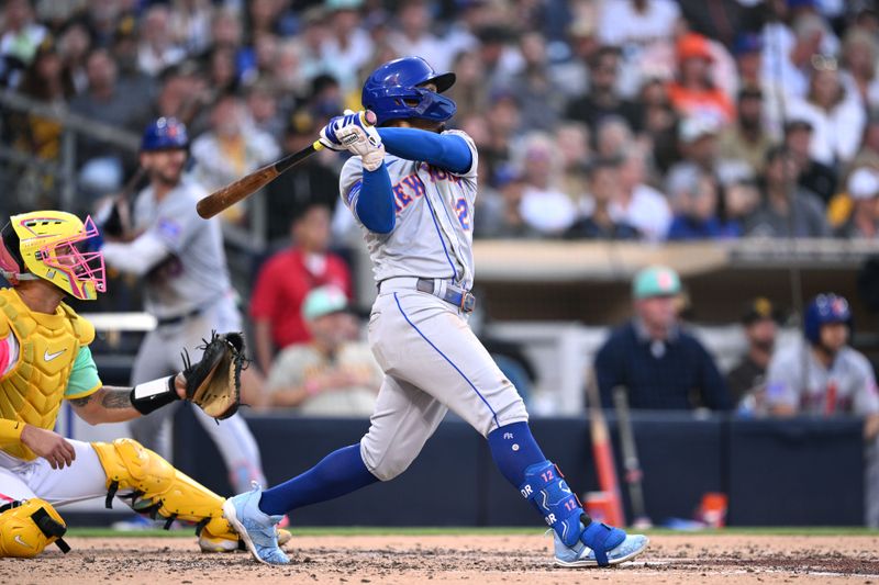 Jul 7, 2023; San Diego, California, USA; New York Mets shortstop Francisco Lindor (12) hits a home run against the San Diego Padres during the third inning at Petco Park. Mandatory Credit: Orlando Ramirez-USA TODAY Sports