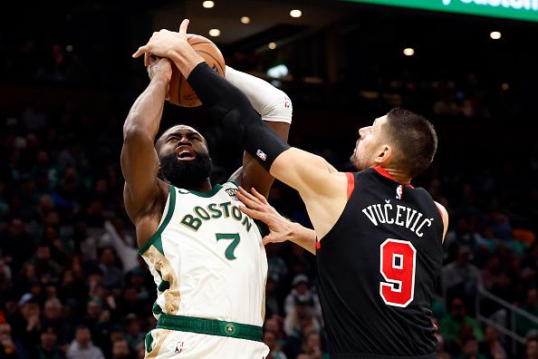 Boston, MA - November 28: Boston Celtics SG Jaylen Brown gets his shot blocked by Chicago Bulls C Nikola Vucevic in the second half. The Celtics beat the Bulls, 124-97. (Photo by Danielle Parhizkaran/The Boston Globe via Getty Images)