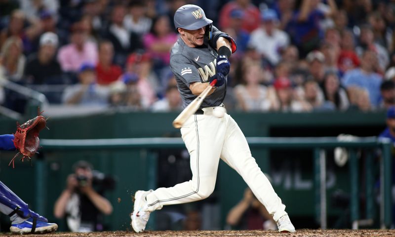 Aug 30, 2024; Washington, District of Columbia, USA; Washington Nationals center fielder Jacob Young (30) hits a two-RBI single during the ninth inning against the Chicago Cubs at Nationals Park. Mandatory Credit: Daniel Kucin Jr.-USA TODAY Sports


