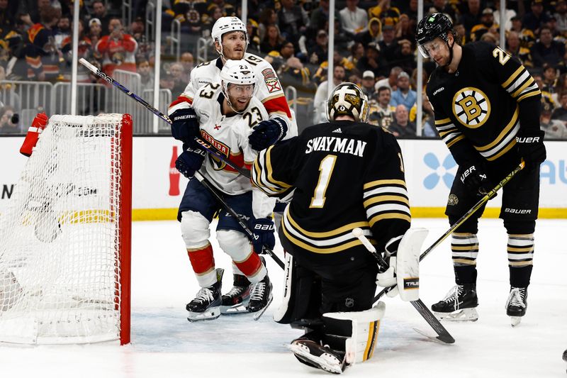 May 10, 2024; Boston, Massachusetts, USA; Florida Panthers center Carter Verhaeghe (23) smiles as he is hugged by left wing Matthew Tkachuk (19) after scoring on Boston Bruins goaltender Jeremy Swayman (1) and defenseman Brandon Carlo (25) during the second period of game three of the second round of the 2024 Stanley Cup Playoffs at TD Garden. Mandatory Credit: Winslow Townson-USA TODAY Sports