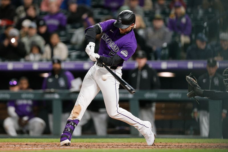 Apr 8, 2024; Denver, Colorado, USA; Colorado Rockies third base Ryan McMahon (24) hits an RBI single in the sixth inning against the Arizona Diamondbacks at Coors Field. Mandatory Credit: Isaiah J. Downing-USA TODAY Sports