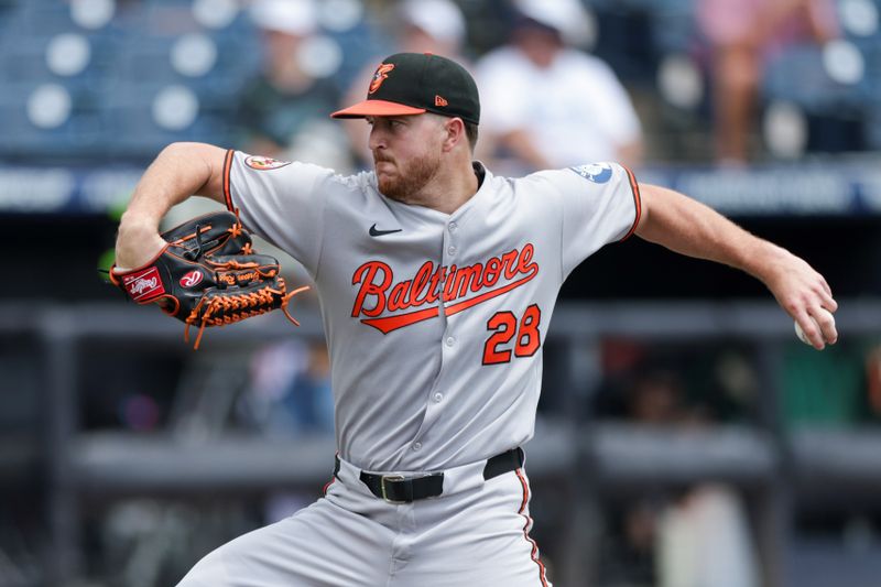 Jul 20, 2025; Tampa, Florida, USA; Baltimore Orioles starting pitcher Trevor Rogers (28) throws a pitch against the Tampa Bay Rays in the first inning at George M. Steinbrenner Field. Mandatory Credit: Nathan Ray Seebeck-Imagn Images